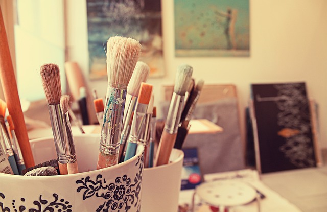 image of art studio with brushes in foreground