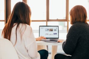 two women looking at an ecommerce website