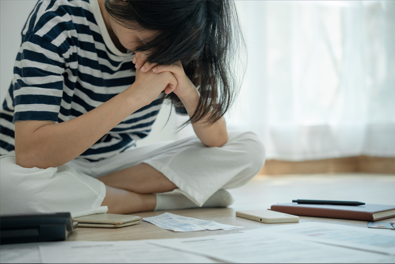 worried woman sitting on floor art isn't selling